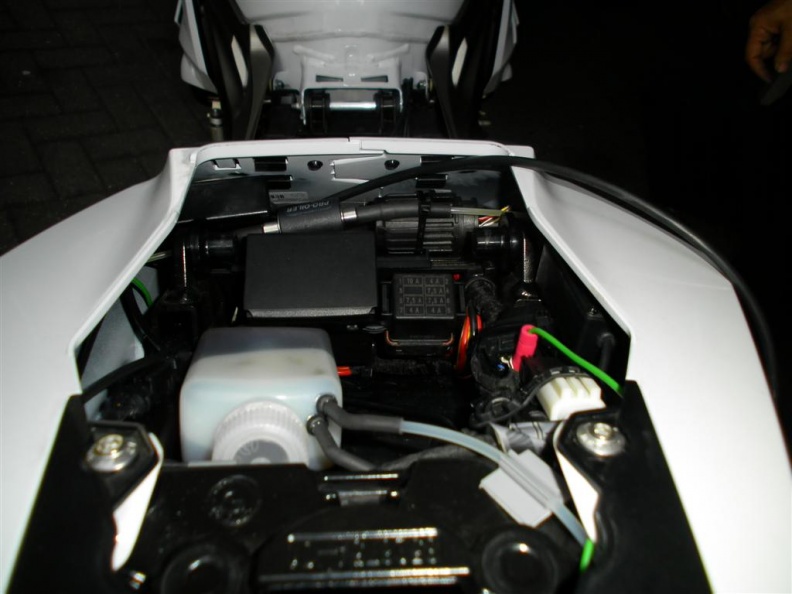 The GPS module is fitted under the right side fairing, you can just see the GPS cable running into the module above the green power wire.
Oil container is obvious.
In the front section the pump is fitted near the junction box. rear_view (Large).JPG