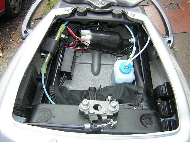 It would not be hard to move the container over to the side in the space between fairing and frame pump container junction box.jpg