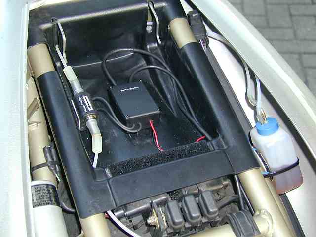 there's plenty of space under the seat for junction box and pump, but you can also install these parts behind the fairing, just like the container. junction box and pump.jpg